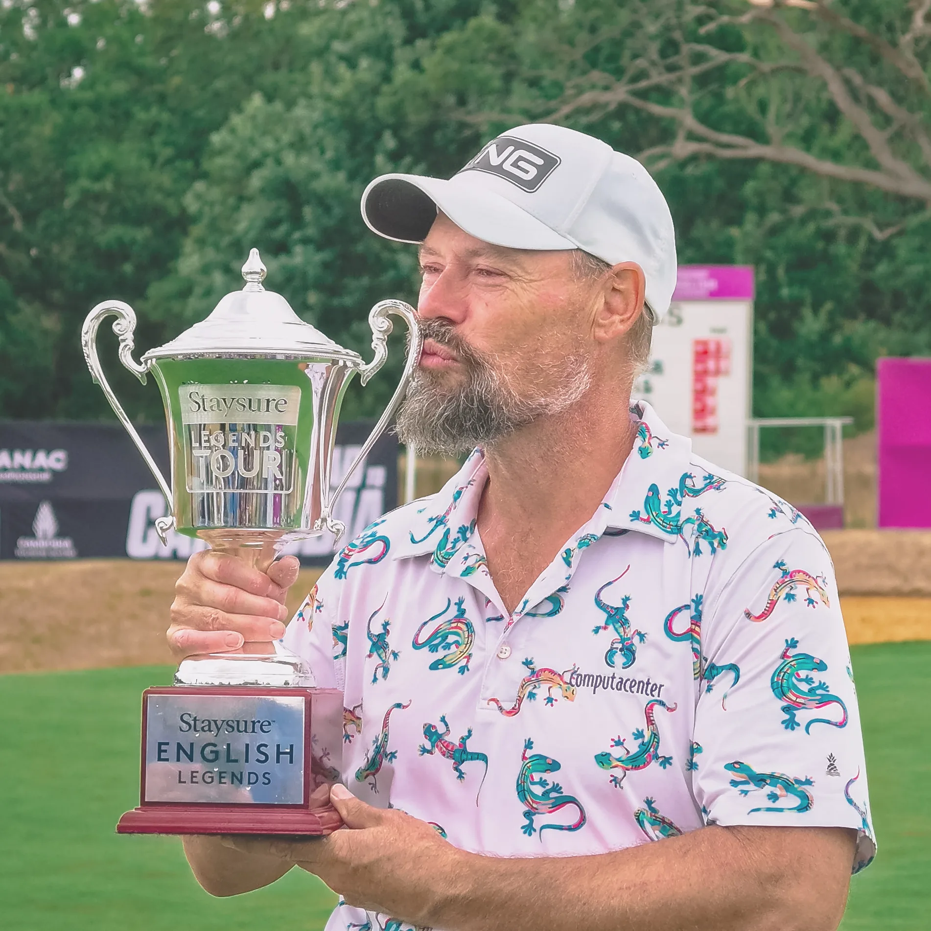 Staysure English Legends winner holding the Legends Tour trophy at Chart Hills Golf Club.